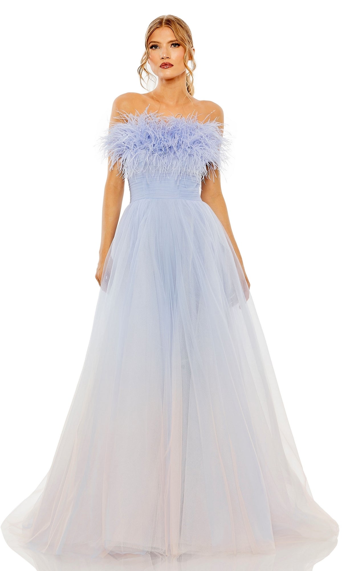 A woman wears the Long Formal Dress 20557 by Mac Duggal, a light blue strapless ball gown with feather-detailed bodice and flowing tulle skirt, standing against a white background.